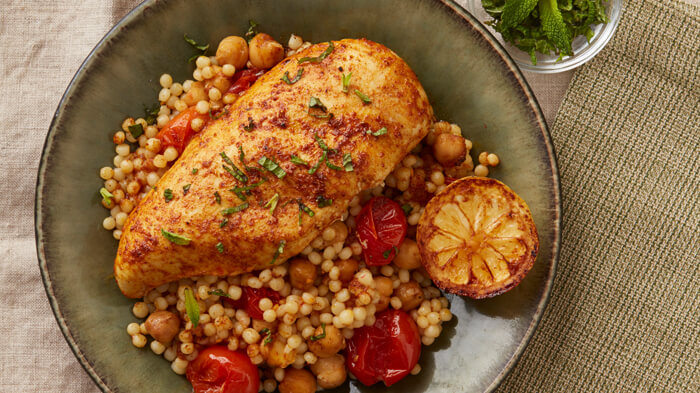 Moroccan Baked Chicken and Couscous with Tomatoes and Chickpeas