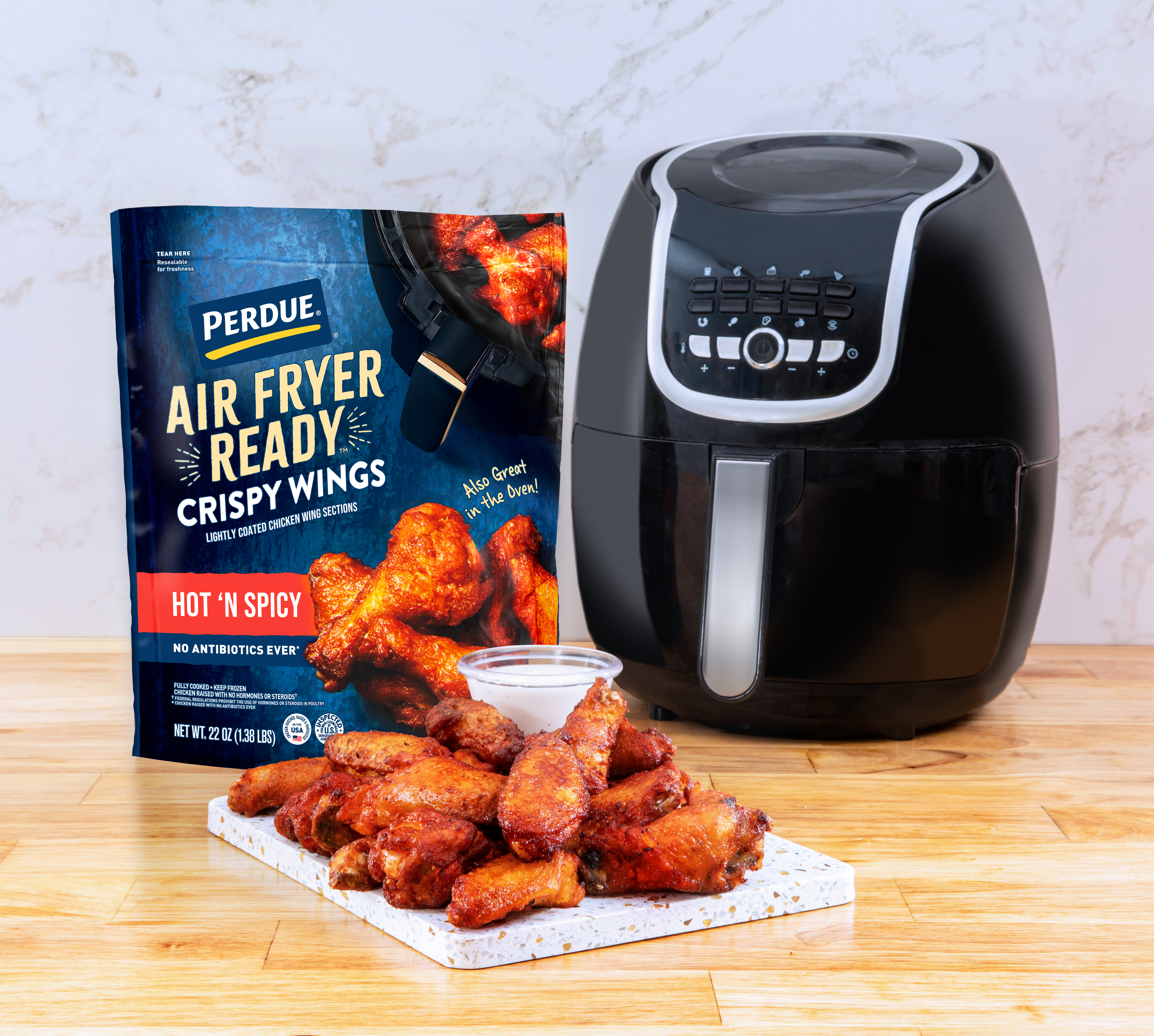 https://www.perdue.com/product-images/Hot_N_Spicy_Bag_Product_and_Air_Fryer_In_Kitchen.jpg