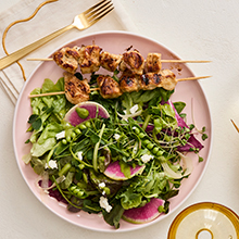 Zesty Chicken Skewers over Spring Salad