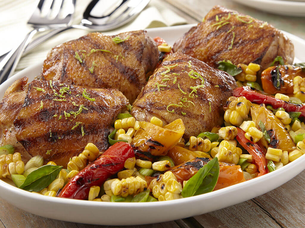 Grilled Coconut-Sazón Marinated Chicken Thighs with Corn Salad